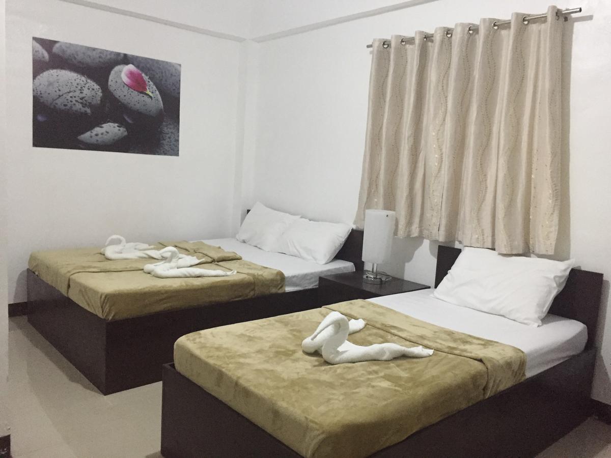 4C'S Tourist Lodge Puerto Princesa Eksteriør bilde